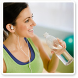 Woman with Bottled Water During Workout