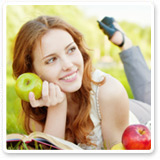 Woman Relaxing While Holding an Apple